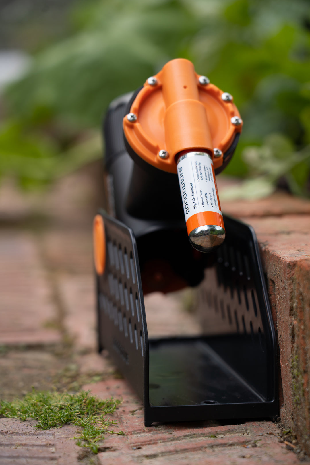Side view of Goodnature A24 rat and mouse trap with CO2 canister attached